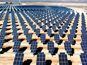 Giant photovoltaic array" by U.S. Air Force photo/Airman 1st Class Nadine Y. Barclay - NELLIS AIR FORCE BASE website - Solar panels connect to base electric gridorignial image. 